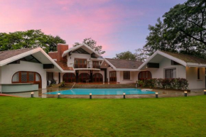 StayVista's Gulmohar Gardens - Mountain Nestled Villa with Outdoor Heated Pool, Cozy Gazebo & Games Room